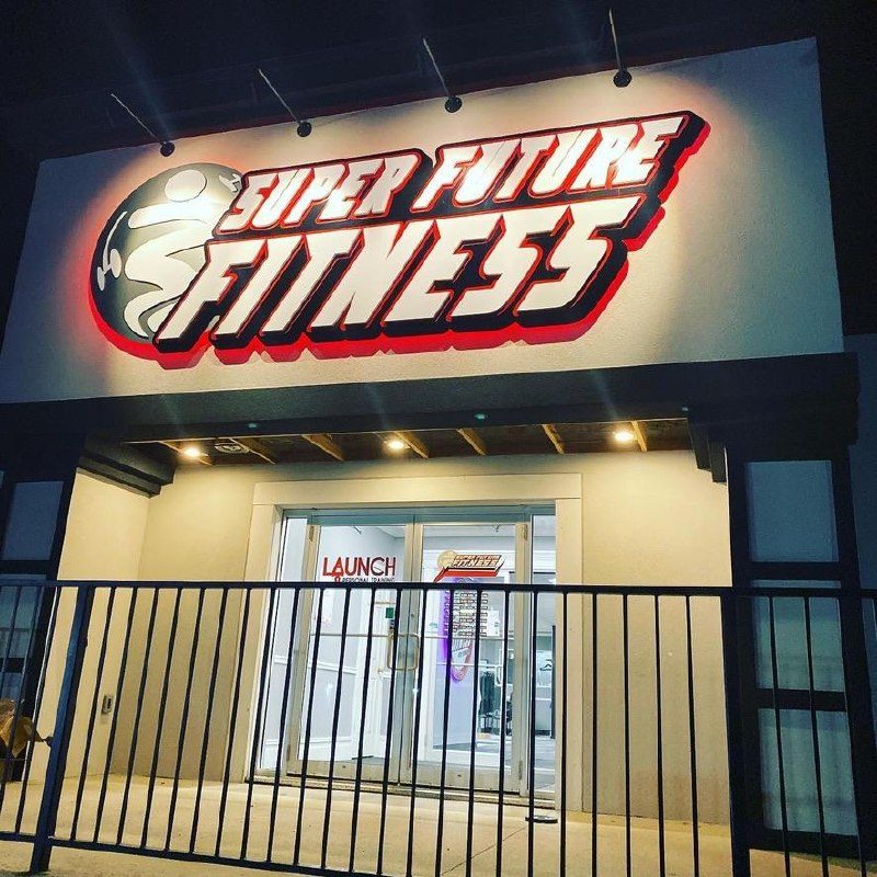 Super Future Fitness entrance lit up at night