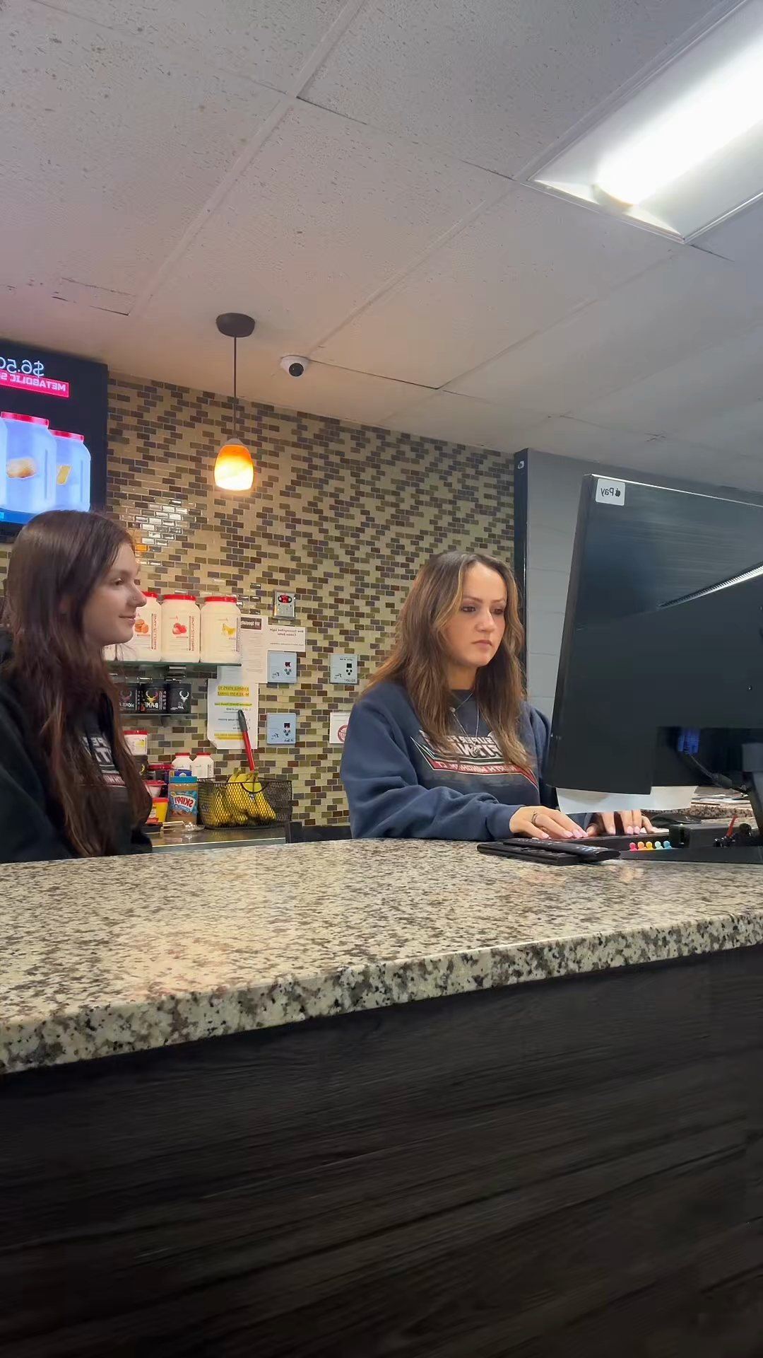 SFF front desk staff welcoming members at the counter