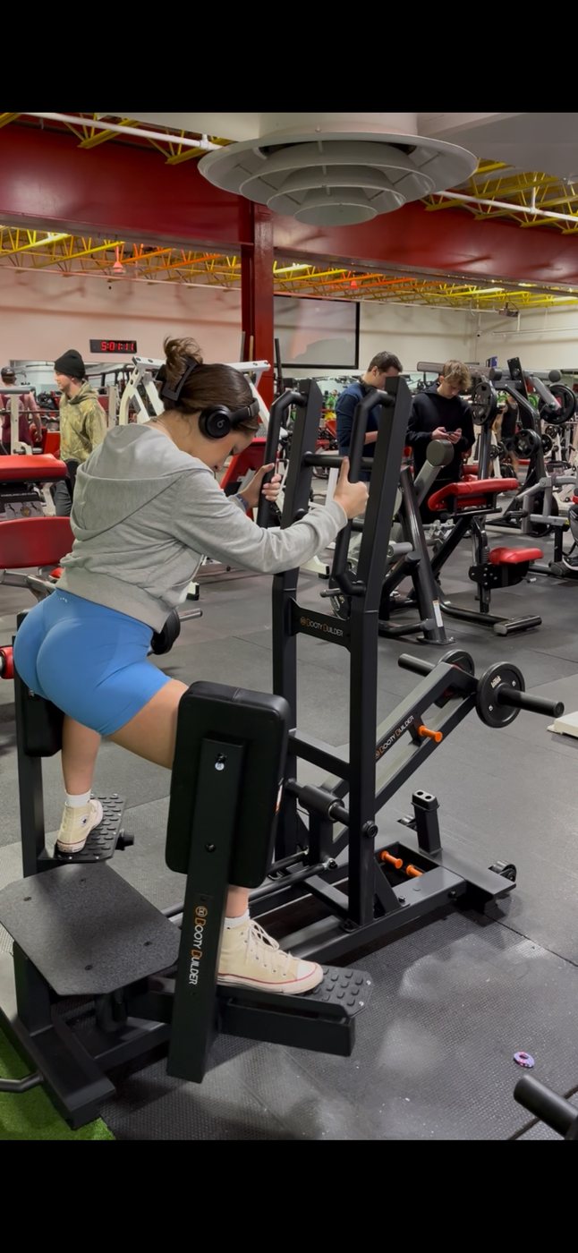 Lower body machine in use at Super Future Fitness